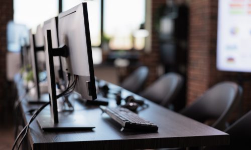No people at call center helpdesk with multiple monitors in office, customer service and client support telecommunication. Nobody working at telemarketing assistance with helpline contact.