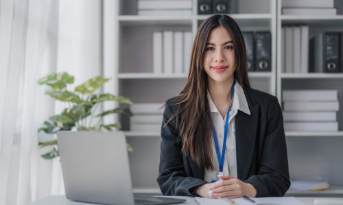 Business woman using calculator for do math finance on wooden desk in office and business working background, tax, accounting, statistics and analytic research concept....