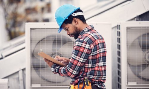 Technician, checklist and air conditioning inspection on roof for safety, power and maintenance. En.